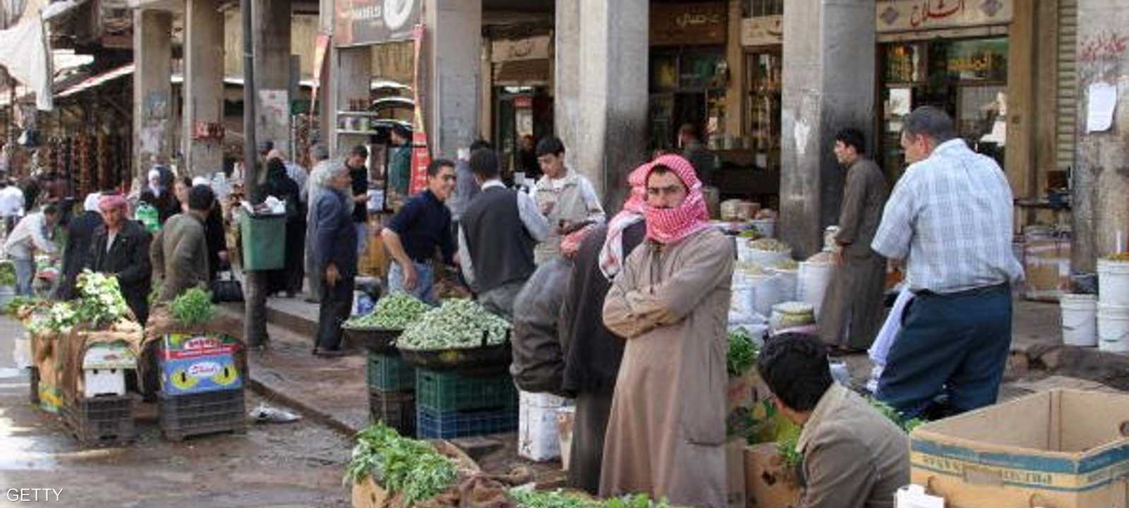 بائعون بأحد شوارع دمشق