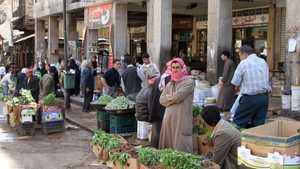 بائعون بأحد شوارع دمشق