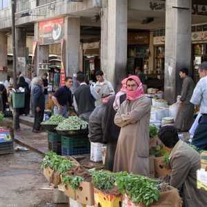 بائعون بأحد شوارع دمشق