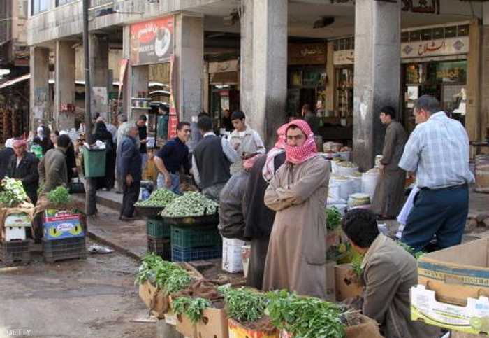 بائعون بأحد شوارع دمشق