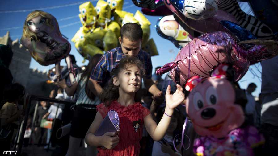 أطفال فلسطينيون فرحون بالعيد