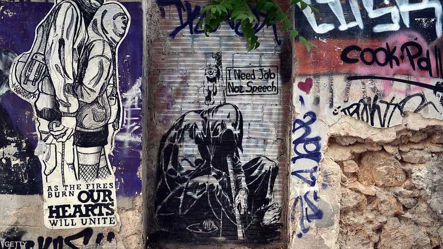 إحدى الرسمات وعليها عبارة "أريد عملا وليس خطابا"