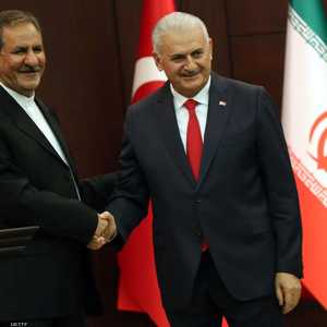 رئيس الوزراء التركي يلدريم ونائب الرئيس الإيراني جاهنغيري