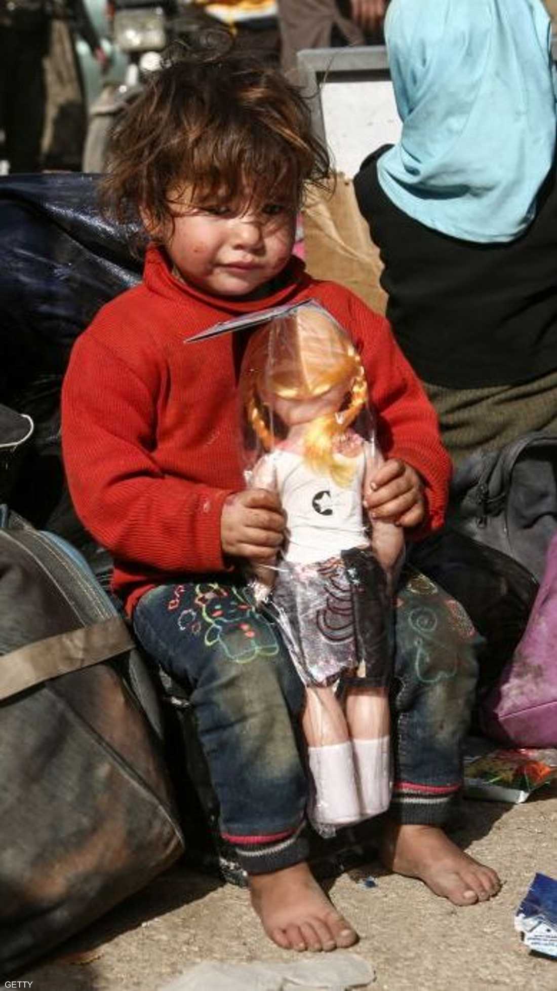 ألعاب لا تخفي نظرة الحزن عن وجوه أطفال الغوطة