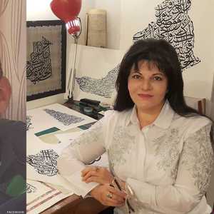 الخطاطة جنة عزت وابنها الراحل حسين العمري