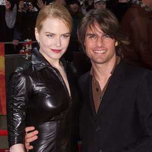 توم كروز ونيكول كيدمان وابنهما (يسار)