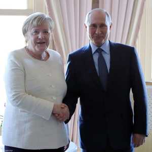 لقاء سابق جمع بين بوتن وميركل