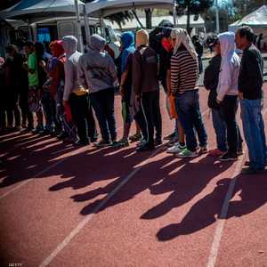 مهاجرون من أمريكا الوسطى يصطفون في طوابير.. أرشيفية