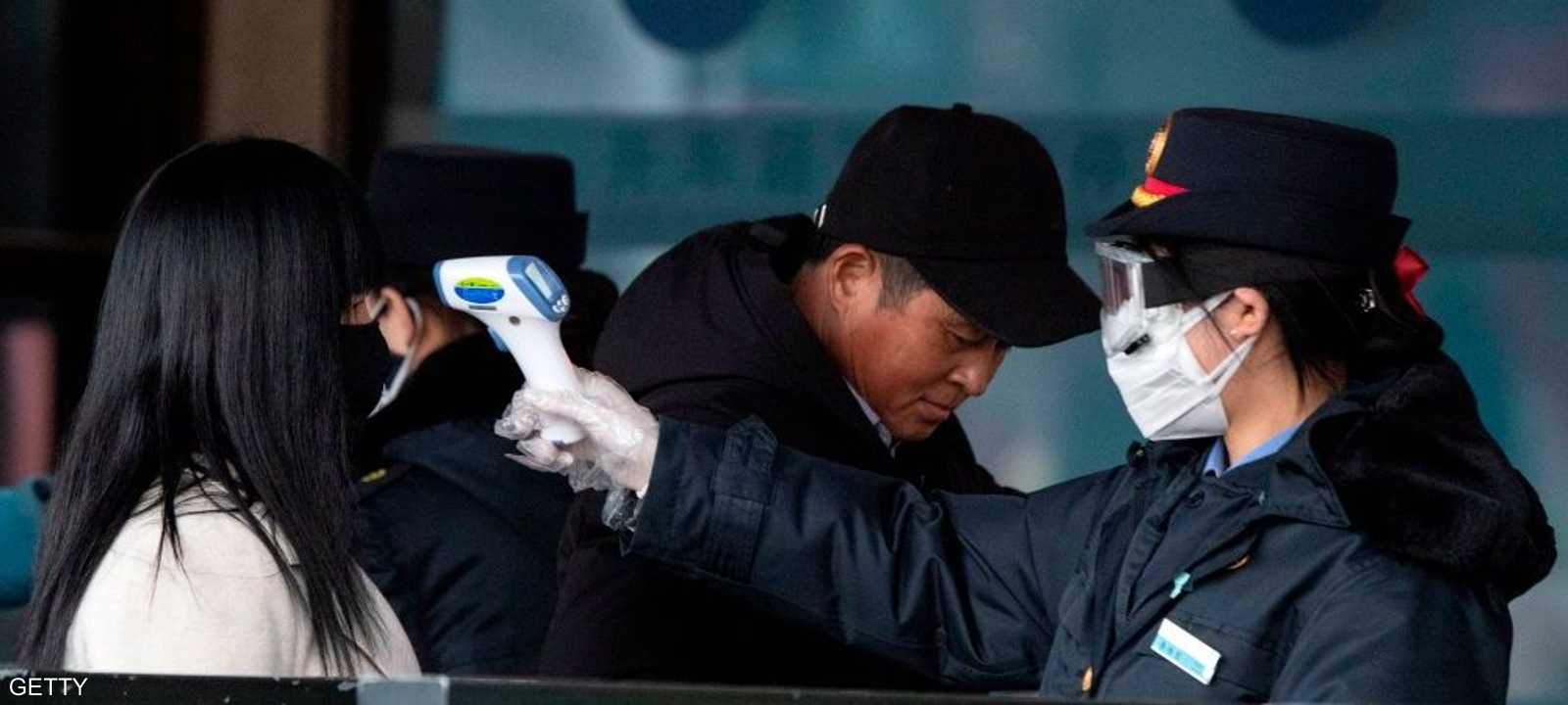 الصين تطبق إجراءات مشددة لكبح انتشار كورونا