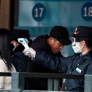 الصين تطبق إجراءات مشددة لكبح انتشار كورونا