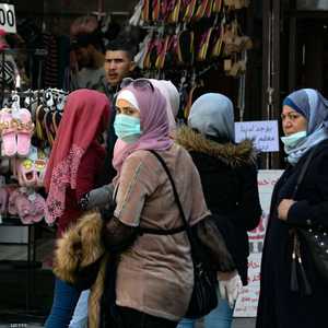 نساء يرتدين كمامات واقية في العاصمة دمشق