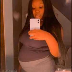 الأم في صورة تذكارية قبل الإنجاب