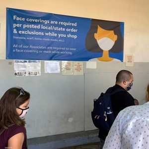 تطلب متاجر عديدة بأميركا من المستهلكين ارتداء الكمامة