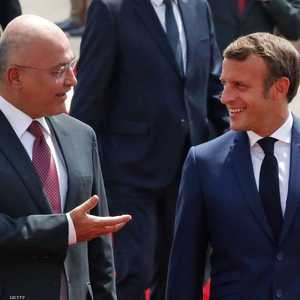 الرئيس العراقي لدى استقباله ماكرون في بغداد