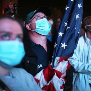 الأميركيون يحتفلون بفوز بايدن وهم يرتدون الكمامات