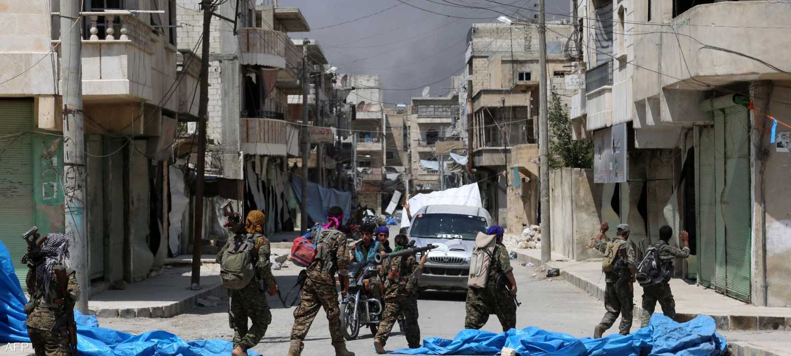 عناصر من قسد في منبج