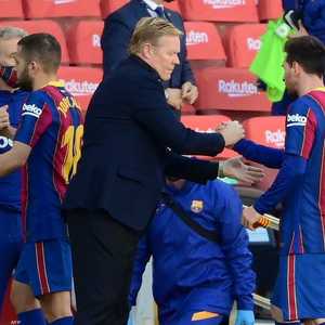 ميسي والمدرب الهولندي كومان