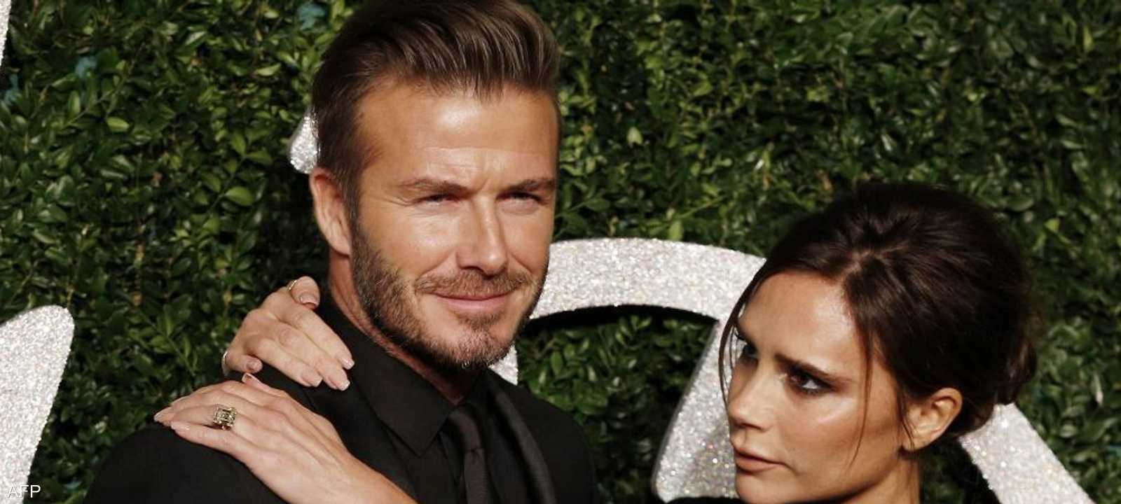 بيكهام وزوجته فيكتوريا