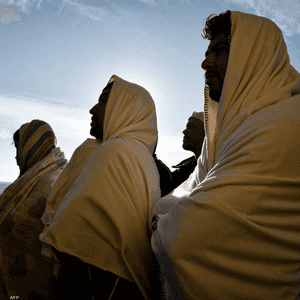 صورة أرشيفية لمهاجرين غير شرعيين أنقذهم خفر السواحل الإيطالي