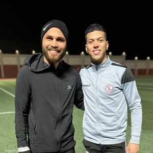 عاشور مع مدربه الخاص أحمد جميل