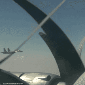 القاذفتان برفقة مقاتلات من طراز SU-30 CM و SU-35 C