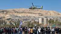 مروحية تلقي الورود خلال احتفالات ذكرى الثورة في دمشق