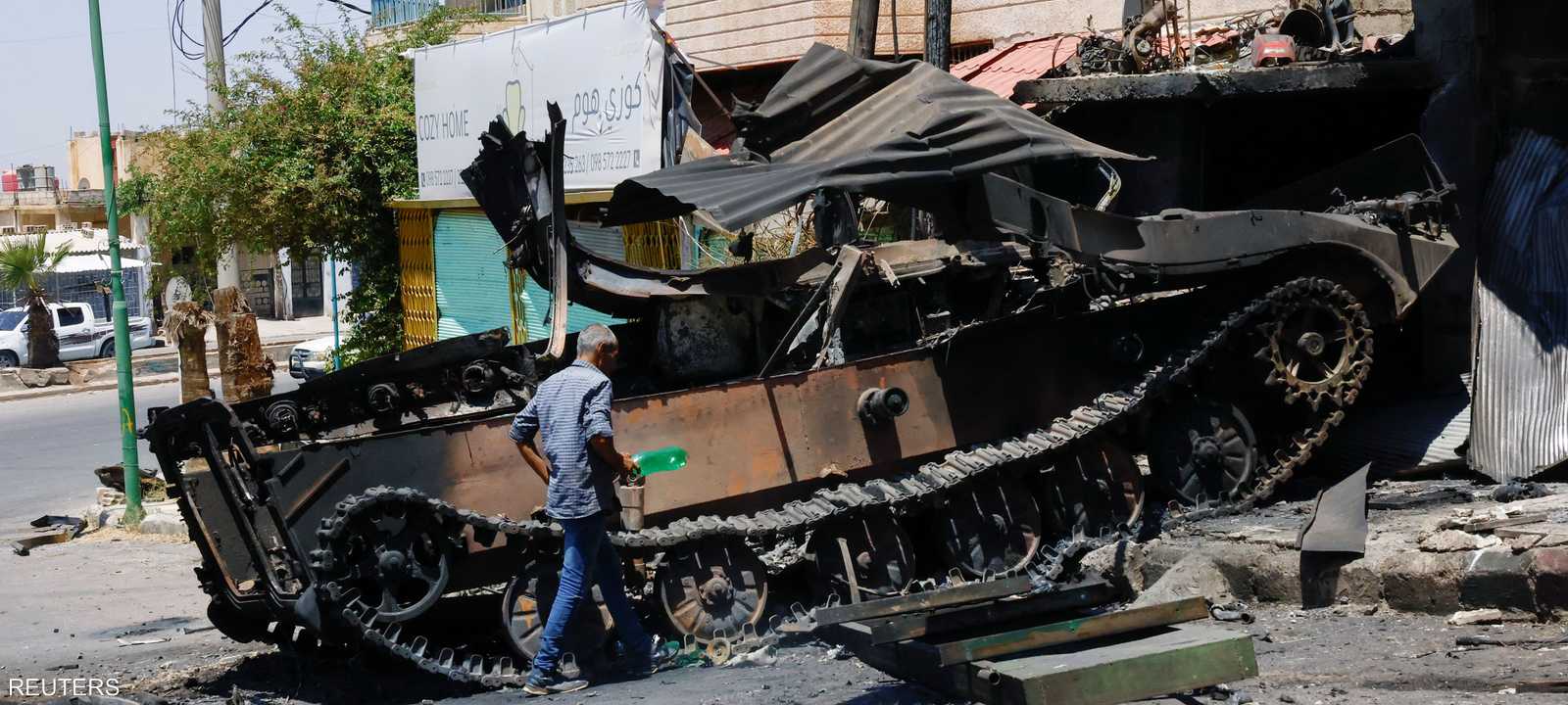 آلية عسكرية مدمرة في السويداء.. أرشيفية