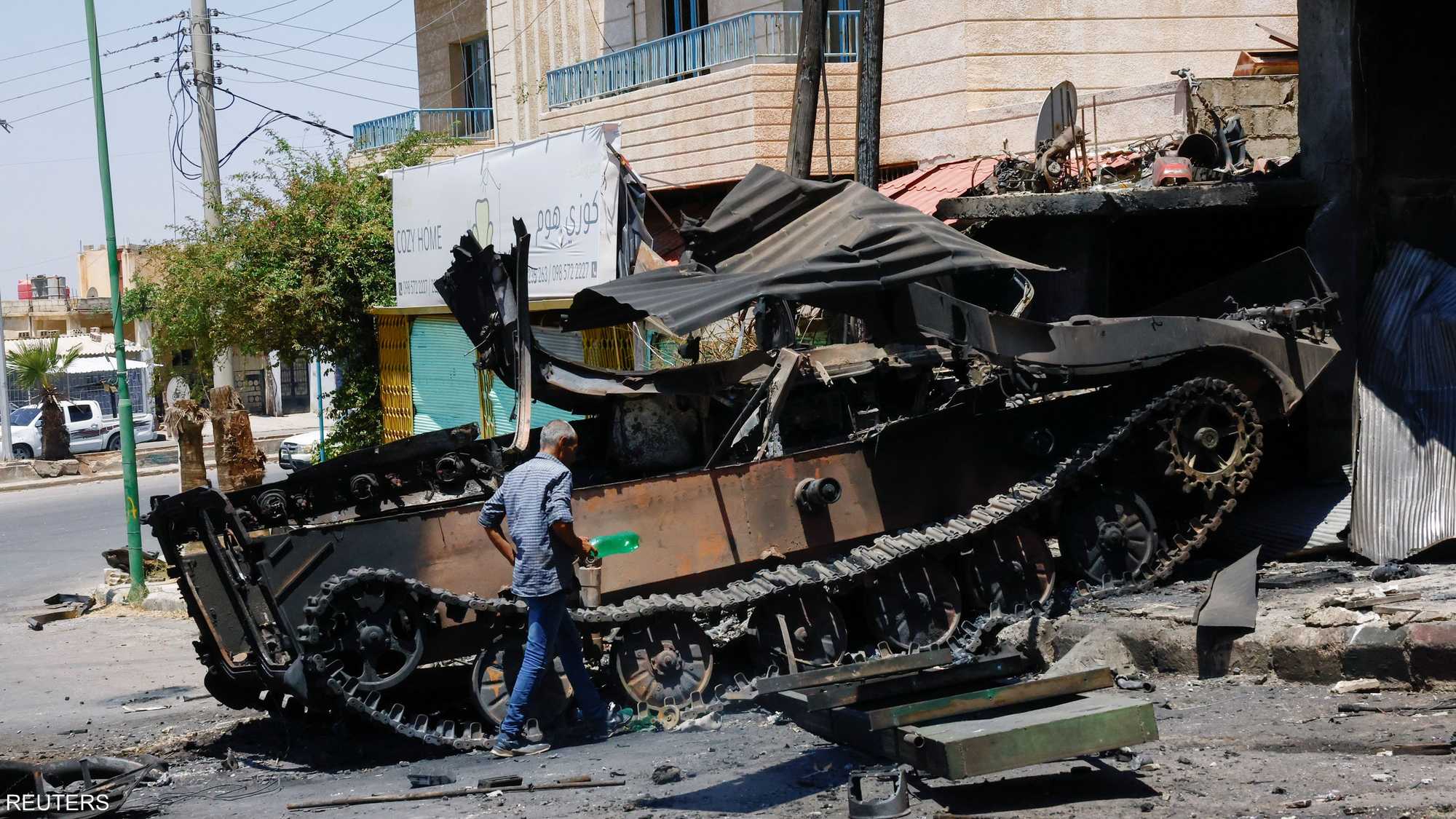 آلية عسكرية مدمرة في السويداء.. أرشيفية