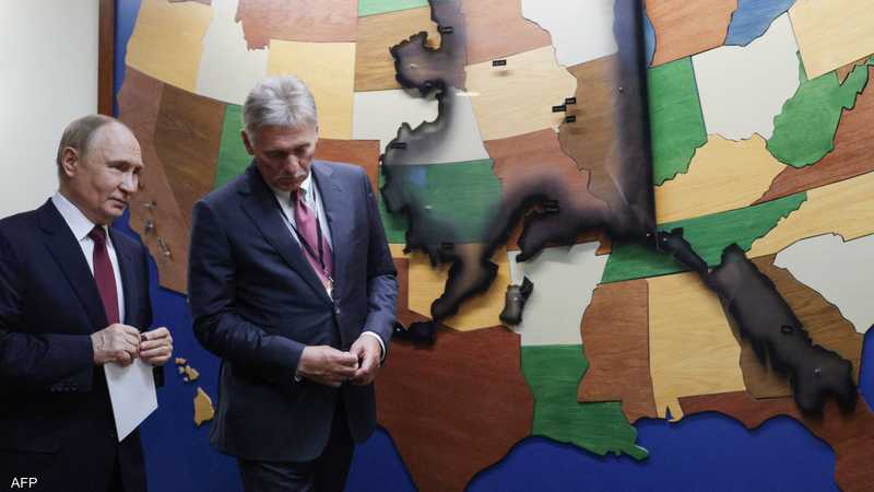 بوتين أمام خريطة للولايات المتحدة