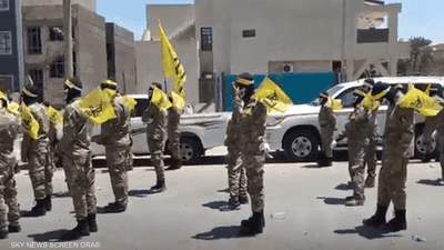 الفصائل العراقية ترفض التخلي عن سلاحها عقب زيارة لاريجاني