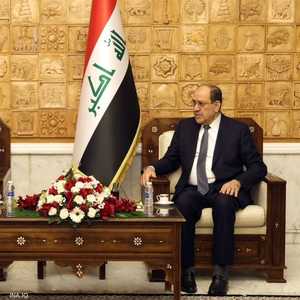 المالكي (يمين الصورة) وجوشوا هاريس