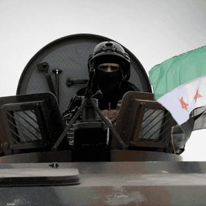 عنصر أمن سوري في الرتل المتوجه للقامشلي