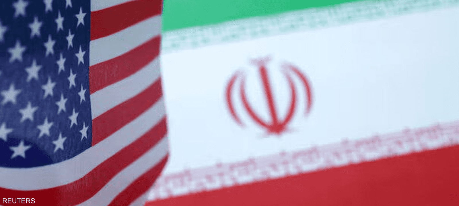 العلمان الأميركي والإيراني في صورة توضيحية