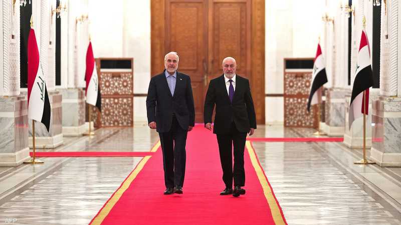 الرئيس العراقي نزار آميدي مع رئيس برلمان إيران