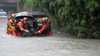 Surprise floods sweeping Thailand and force hundreds of families to evacuate