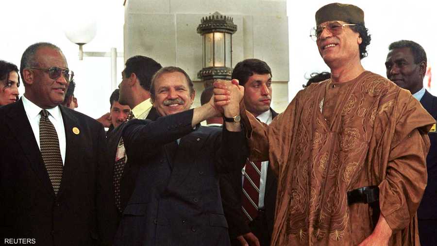 مع الزعيم الليبي الراحل معمر القذافي